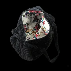 Upcycled black corduroy duffle bag with floral lining