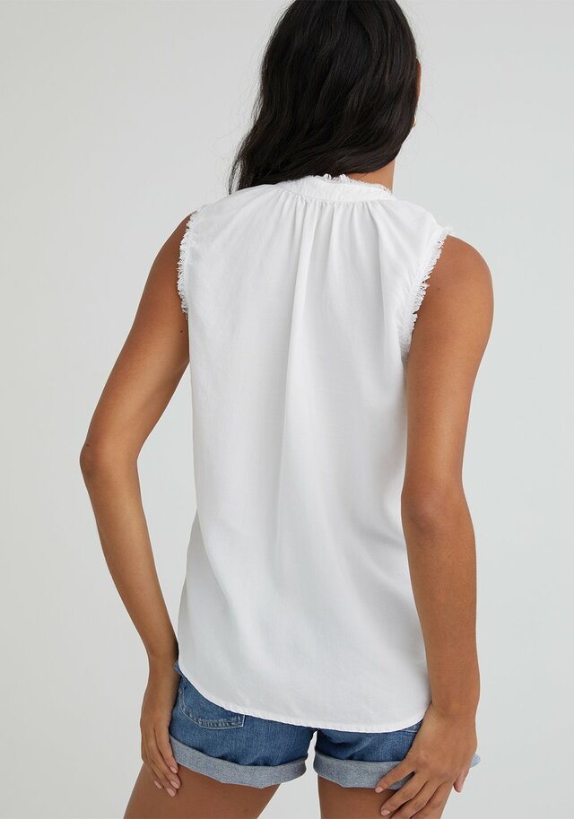 White sleeveless fray edge pullover tank